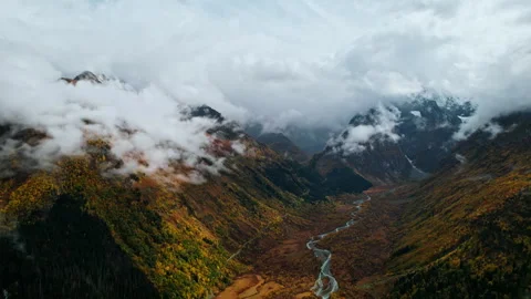 Fascinating Aerial View On Riverbed In Valley Between High Mountains In Cloudy Stock Footage 254288913