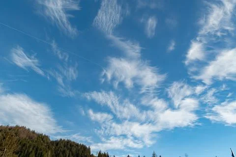 Fascinating cloud formation in the blue sky over Einsiedeln in Switzerland Stock Photos