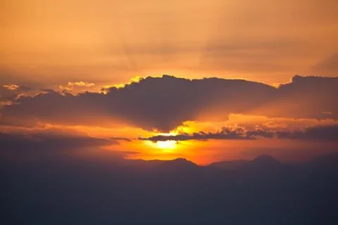 Fascinating cloudscape sunset with rays Stock Photos