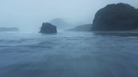 Fascinating drone footage of the pristine beach, surrounded by the rocky cliffs 스톡 동영상 168105070
