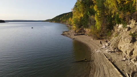 Fascinating flight on a quadrocopter over the river along the forest Stock Footage 144035188