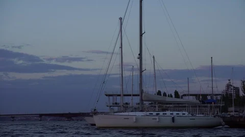 Fascinating low angle panoramic view on white luxury yacht boat swaying in calm Stock Footage 94835816
