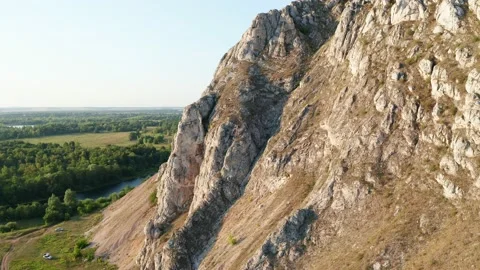 Fascinating panorama of the natural landscape. Sharp rocky ledge against the Stock Footage 158532152