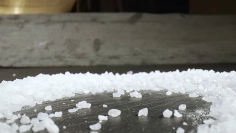Fascinating probelens super closeup macro dolly shot of salt on kitchen plate Stock Footage 153058970
