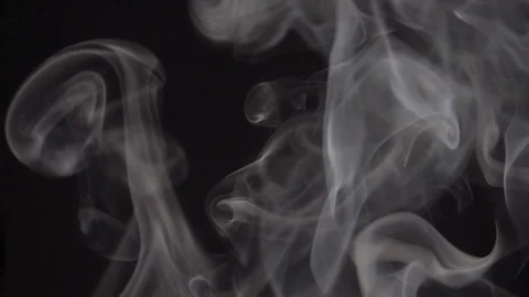Fascinating real smoke slowly floating and rolling against dark background 動画素材 110457600