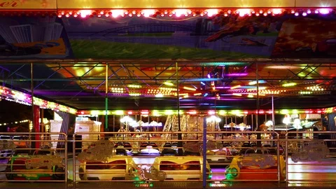 Fascinating steady time lapse view on children kart racing attraction in Stock Footage 98404528