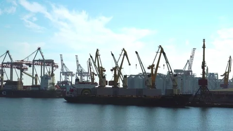 Fascinating steady time lapse view on mechanical cranes unloading freight from Stock Footage 98408361