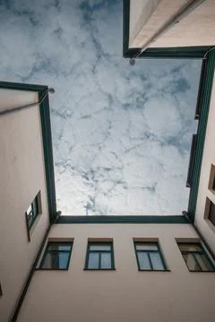 Fascinating view from the bottom of the building to the top where you can see Stock Photos