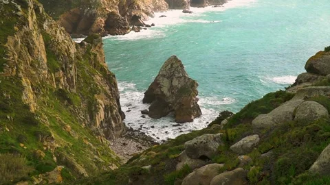 Fascinating view on a rocky cliff sticking out from the ocean Stock Footage 149129560