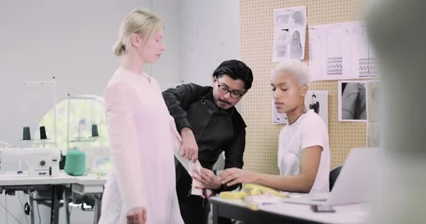 Fashion designer with apprentice and model Stock Footage 108180144