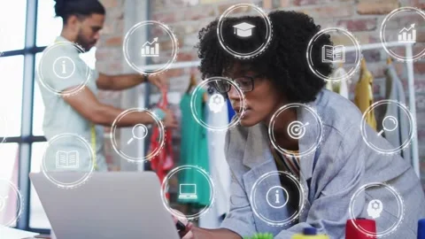 Fashion designer comparing device data upon making call with data icons floating Stock Footage 317228183