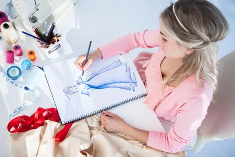 Fashion designer drawing clothes Stock Photos