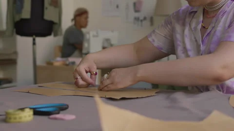 Fashion Designer Making Pattern in Workshop Stock Footage 310857181
