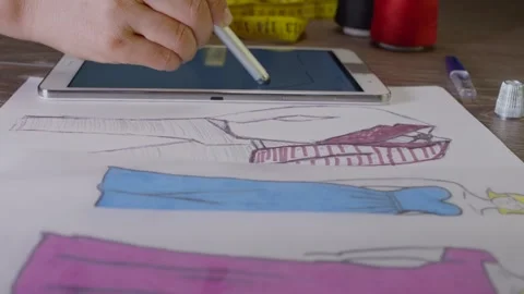 Fashion Designer Working On A Digital Tablet Stock Footage 243610107