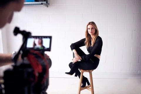 Fashion Model Being Filmed With Video Camera In Studio Stock Photos