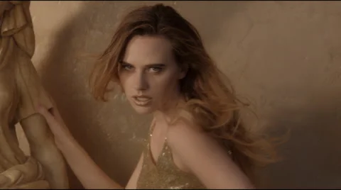 Fashion model with dynamic posing against gold 스톡 동영상 45796744