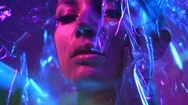 Fashion Model Girl In Colorful Neon Uv Lights Posing Through Transparent Film Stock Footage