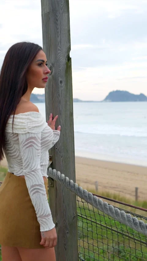 Fashion model posing on beach boardwalk Stock Footage 308010754