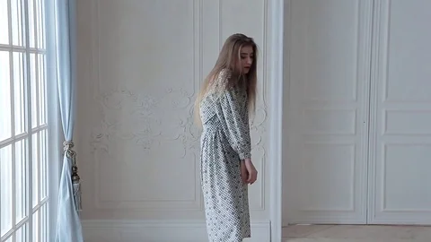 Fashion model posing in white interior Stock Footage 72660536