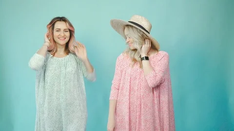 Fashion photo: different girls in dresses together in photo studio Stock Footage