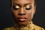 Fashion Portrait Of Glossy African American Woman With Bright Golden Makeup.  Stock Photos