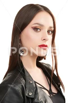 Fashion shot. Portrait of a beautiful brunette girl posing in black leather j Stock-Fotos