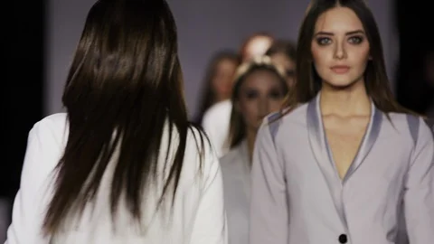 Fashion show design female clothes woman slow motion on podium close up stage 4K Stock Footage