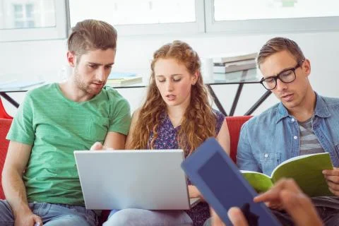 Fashion students looking at computer Foto stock