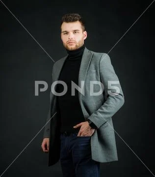 Fashion style portrait of a handsome guy in suit. Stock Photos