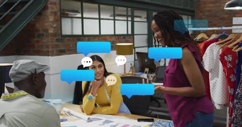 Fashion team at table receiving chat messages spawning bubbles disappearing Stock Footage 312844516