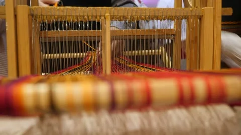 Fashion trends. Craftsmanship background. Process of weaving on vintage loom Stock-Footage 133664482