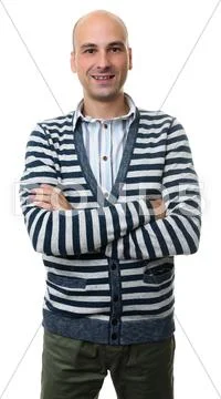 Fashionable bald guy standing with his arms crossed Stock Photos
