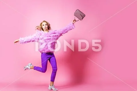 Fashionable bright lady posing in studio. Fashion for women. Pink colors. Stock-Fotos