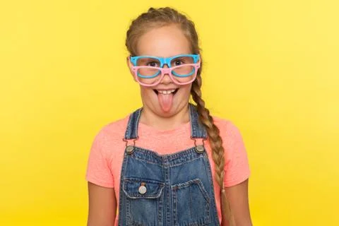 Fashionable eyeglasses. Portrait of little girl wearing two stylish eyeglasse Stock Photos
