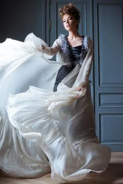 Fashionable female portrait of cute lady in dress indoors Stock Photos