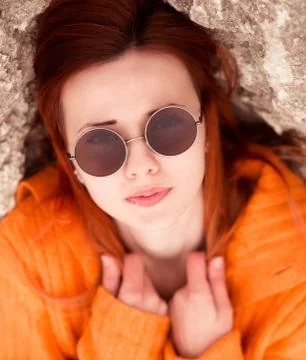 Fashionable portrait of  red-haired,nice girl with modern round cool sunglasses Stock Photos