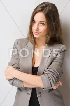 Fashionable young brunette woman. Stock Photos