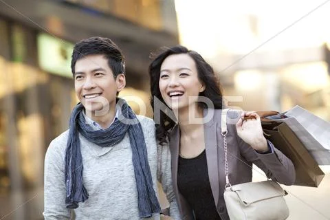 Fashionable young couple shopping Stock Photos