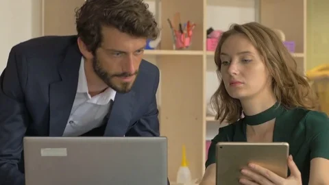 Fashionably dressed workers discussing the strategy of the marketing. Stock Footage 80468024