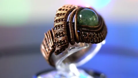 Fashioned cooper ring with one gem stone, hand made. Rotation 360 Stock Footage 93808323