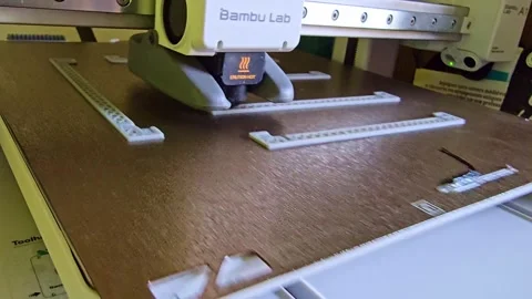 Fast 3D Printer Operating While Producing Plastic Components on Build Plate Stock Footage 323869090