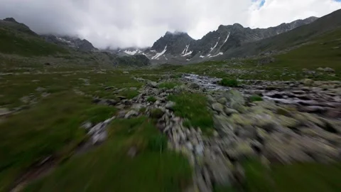 Fast aerial flight over mountain stream and rocks Video stock 344966964