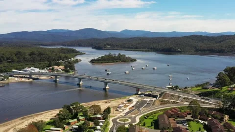 Fast aerial flying over Clyde river to Princess highway bridge, Batemans bay. Stock Footage 194744069