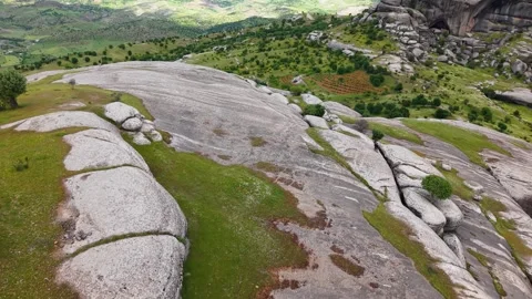 Fast Aerial Orbit Around Massive Rock Formation Turning Left Vídeos de archivo 344543115