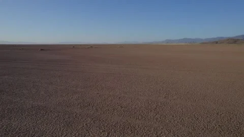 Fast aerial over a vast desolate desert Stock Footage 249827914