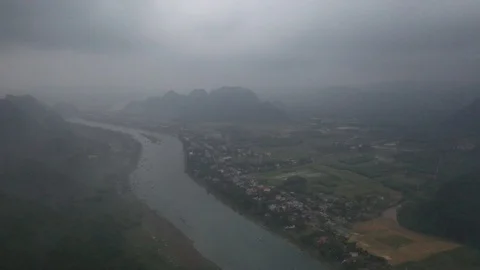 Fast Aerial Shot Through Clouds of Village in Vietnam Stock Footage 125502347