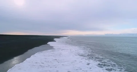 Fast aerial tracking of ocean waves crashing on beach Видео 79856188
