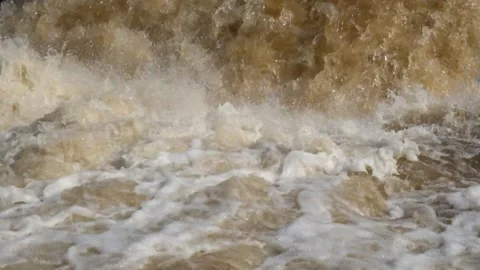 Fast and murky river cascade brown and foamy Stock Footage 321282041