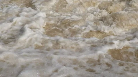 Fast and murky river cascade brown and foamy Stock Footage 321282047