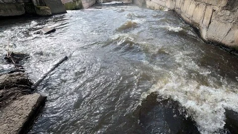 Fast and strong water flow down the slope. Stock Footage 126333347